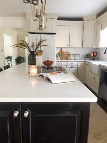 We swapped our granite for these gorgeous white quartz countertops and we LOVE them! #quartzcountertops