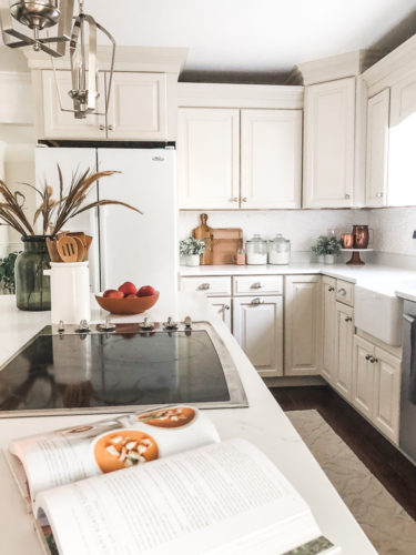 We swapped our granite for these gorgeous white quartz countertops and we LOVE them! #quartzcountertops