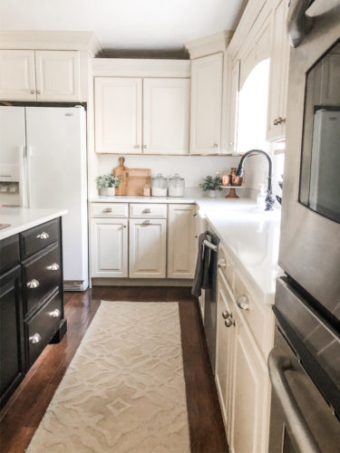 We swapped our granite for these gorgeous white quartz countertops and we LOVE them! #quartzcountertops