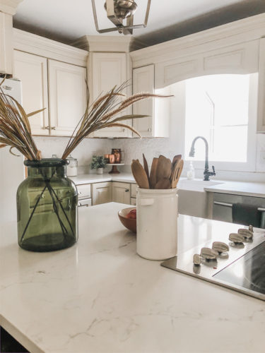 We swapped our granite for these gorgeous white quartz countertops and we LOVE them! #quartzcountertops