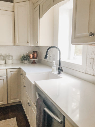 We swapped our granite for these gorgeous white quartz countertops and we LOVE them! #quartzcountertops