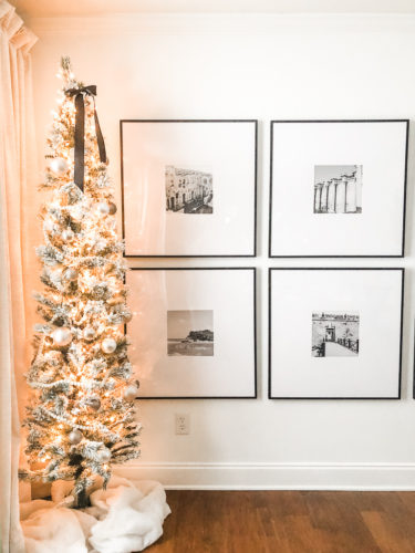 Learn how to get a high end look with a custom gallery wall! You'll learn how to decorate a large wall the easy way! #decoratealargewall #gallerywall