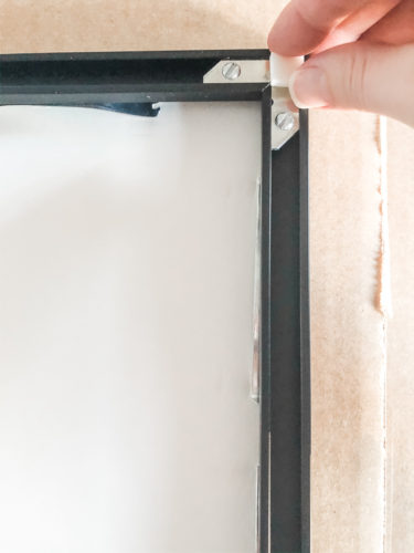 Learn how to get a high end look with a custom gallery wall! You'll learn how to decorate a large wall the easy way! #decoratealargewall #gallerywall