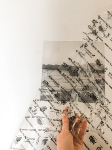 Learn how to get a high end look with a custom gallery wall! You'll learn how to decorate a large wall the easy way! #decoratealargewall #gallerywall