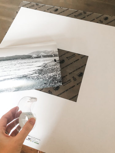 Learn how to get a high end look with a custom gallery wall! You'll learn how to decorate a large wall the easy way! #decoratealargewall #gallerywall
