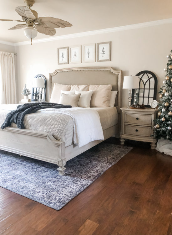 Simple and easy neutral Christmas decor in the bedroom! A Christmas tree, some pinecones and some pine touches complete this space! #christmasbedroom #neutralchristmas