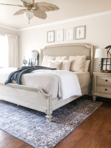 Simple and easy neutral Christmas decor in the bedroom! A Christmas tree, some pinecones and some pine touches complete this space! #christmasbedroom #neutralchristmas