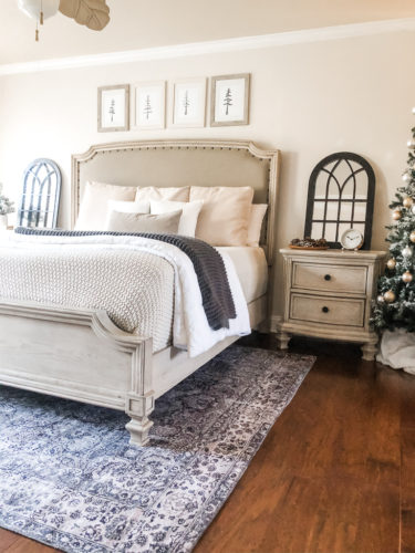 Simple and easy neutral Christmas decor in the bedroom! A Christmas tree, some pinecones and some pine touches complete this space! #christmasbedroom #neutralchristmas