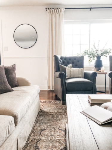 This cozy sitting area makes me want to curl up with a good book and sip a cup of hot tea. #cozysittingarea