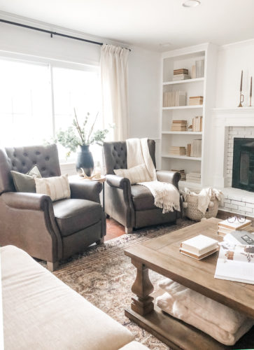 This cozy sitting area makes me want to curl up with a good book and sip a cup of hot tea. #cozysittingarea