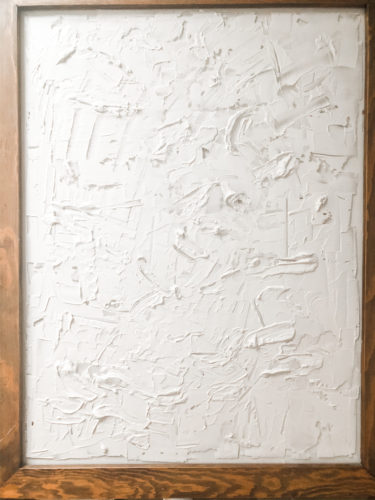 Learn how to make your own expensive-looking textured, abstract wall art. Convert old art paintings into new, modern artwork for your home. This project is super budget-friendly! #DIYWallArt #Abstractarttutorial #texturedwallart #modernart