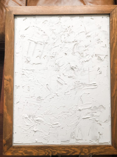 Learn how to make your own expensive-looking textured, abstract wall art. Convert old art paintings into new, modern artwork for your home. This project is super budget-friendly! #DIYWallArt #Abstractarttutorial #texturedwallart #modernart