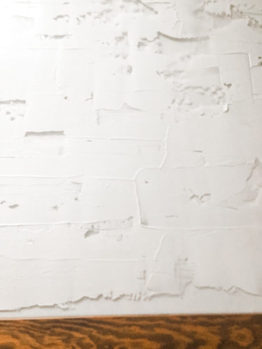 Learn how to make your own expensive-looking textured, abstract wall art. Convert old art paintings into new, modern artwork for your home. This project is super budget-friendly! #DIYWallArt #Abstractarttutorial #texturedwallart #modernart