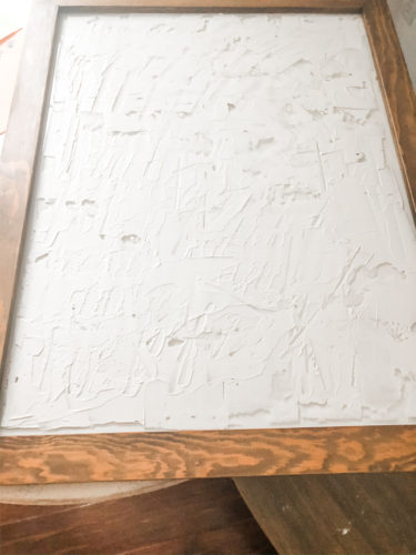 Learn how to make your own expensive-looking textured, abstract wall art. Convert old art paintings into new, modern artwork for your home. This project is super budget-friendly! #DIYWallArt #Abstractarttutorial #texturedwallart #modernart