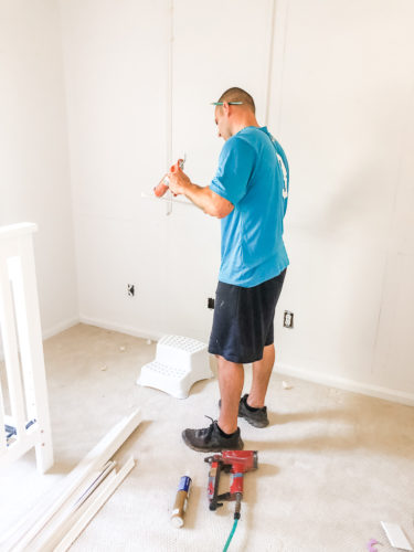 Learn how to install picture frame molding for an accent wall! Measuring tips, spacing, tools you'll need & more. #pictureframemolding #howtoinstallmolding #accentwall #pictureframemoldingaccentwall