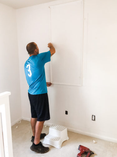 Learn how to install picture frame molding for an accent wall! Measuring tips, spacing, tools you'll need & more. #pictureframemolding #howtoinstallmolding #accentwall #pictureframemoldingaccentwall