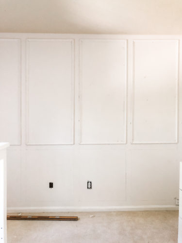 Learn how to install picture frame molding for an accent wall! Measuring tips, spacing, tools you'll need & more. #pictureframemolding #howtoinstallmolding #accentwall #pictureframemoldingaccentwall