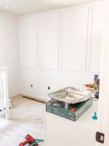 Learn how to install picture frame molding for an accent wall! Measuring tips, spacing, tools you'll need & more. #pictureframemolding #howtoinstallmolding #accentwall #pictureframemoldingaccentwall