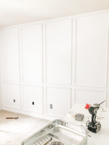 Learn how to install picture frame molding for an accent wall! Measuring tips, spacing, tools you'll need & more. #pictureframemolding #howtoinstallmolding #accentwall #pictureframemoldingaccentwall