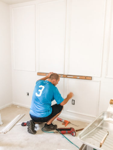Learn how to install picture frame molding for an accent wall! Measuring tips, spacing, tools you'll need & more. #pictureframemolding #howtoinstallmolding #accentwall #pictureframemoldingaccentwall