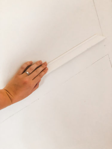 Learn how to install picture frame molding for an accent wall! Measuring tips, spacing, tools you'll need & more. #pictureframemolding #howtoinstallmolding #accentwall #pictureframemoldingaccentwall