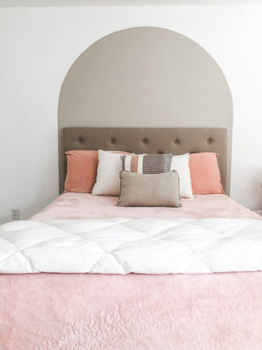 Learn how to paint an arch on a wall in any room for a budget-friendly statement! See how she made a DIY compass to make this large arch look symmetrical. #archonawall