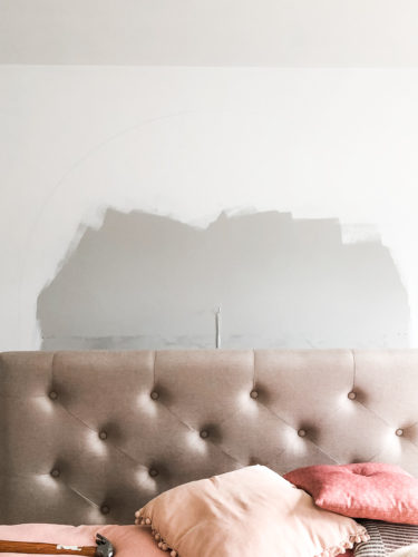 Learn how to paint an arch on a wall in any room for a budget-friendly statement! See how she made a DIY compass to make this large arch look symmetrical. #archonawall