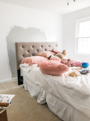 Learn how to paint an arch on a wall in any room for a budget-friendly statement! See how she made a DIY compass to make this large arch look symmetrical. #archonawall