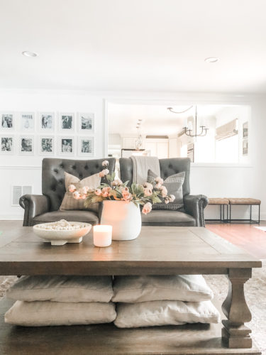 This living room decor is cozy and elegant! She mixes comfy, neutral furniture and decor for a relaxing retreat! #livingroomdecorcozy