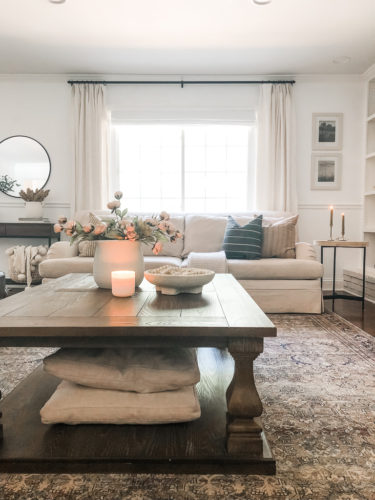 This living room decor is cozy and elegant! She mixes comfy, neutral furniture and decor for a relaxing retreat! #livingroomdecorcozy
