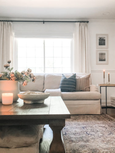 This living room decor is cozy and elegant! She mixes comfy, neutral furniture and decor for a relaxing retreat! #livingroomdecorcozy