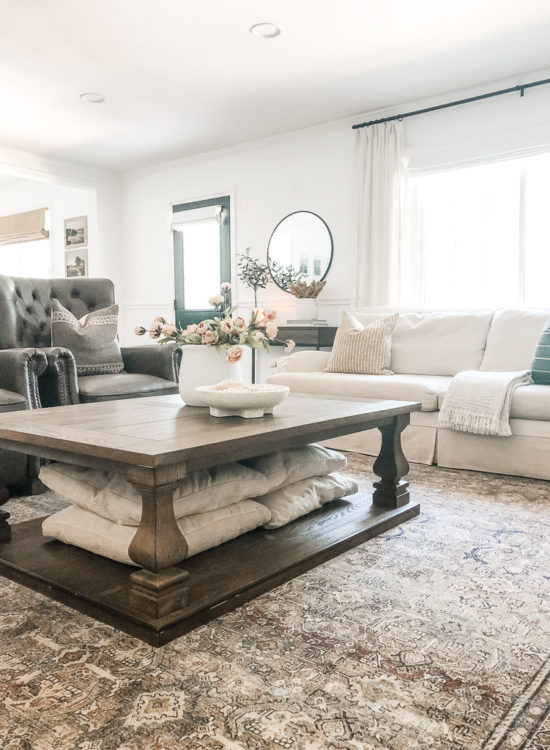 This living room decor is cozy and elegant! She mixes comfy, neutral furniture and decor for a relaxing retreat! #livingroomdecorcozy