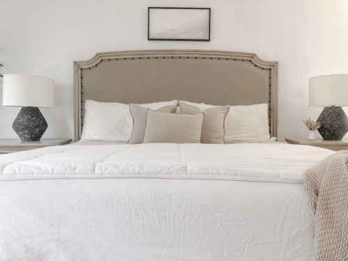 This neutral bedroom is simple yet sophisticated. These lamps & DY artwork are beautiful bedroom decor ideas.