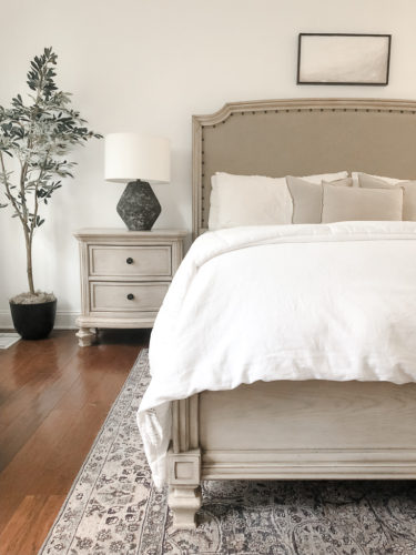 This neutral bedroom is simple yet sophisticated. These lamps & DY artwork are beautiful bedroom decor ideas.