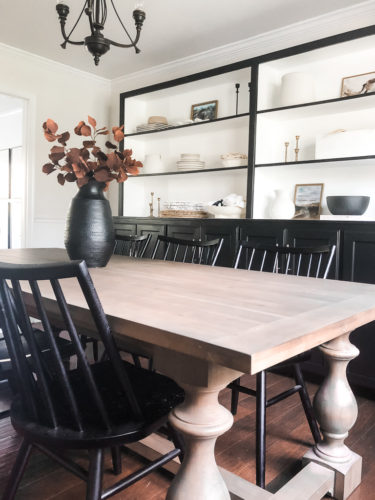 Tips for simple and modern bookcase styling using black, white and cream tones. #modernbookcasestyling #bookcasestyling