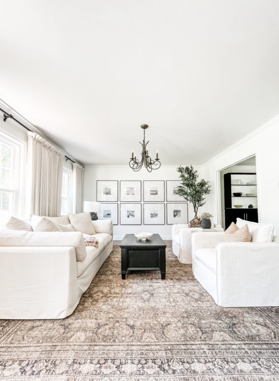 Sophisticated living room tour primarily using the the colors black and white. #sophisticatedlivingroom #blackandwhitelivingroom #loloirugs #marlydiceblog