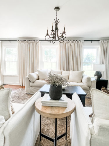 Sophisticated living room tour primarily using the the colors black and white. #sophisticatedlivingroom #blackandwhitelivingroom #loloirugs #marlydiceblog