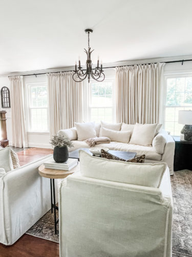 Sophisticated living room tour primarily using the the colors black and white. #sophisticatedlivingroom #blackandwhitelivingroom #loloirugs #marlydiceblog