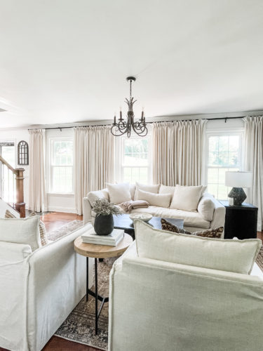 Sophisticated living room tour primarily using the the colors black and white. #sophisticatedlivingroom #blackandwhitelivingroom #loloirugs #marlydiceblog