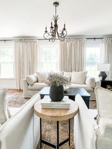 Sophisticated living room tour primarily using the the colors black and white. #sophisticatedlivingroom #blackandwhitelivingroom #loloirugs #marlydiceblog