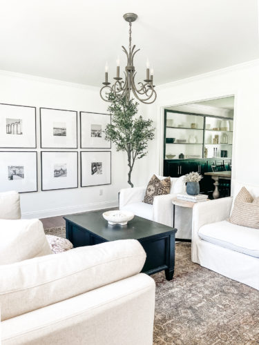Sophisticated living room tour primarily using the the colors black and white. #sophisticatedlivingroom #blackandwhitelivingroom #loloirugs #marlydiceblog