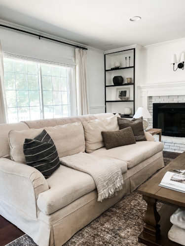 Black and white bookcase with vintage style decor