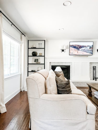 Black and white bookcase with vintage style decor