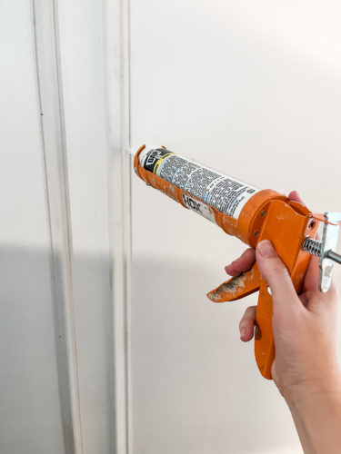 Learn how to install DIY wall moulding AKA picture frame moulding in this step-by-step process, which includes video! #diywallmoulding #pictureframemoulding