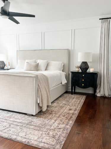 Black and white transitional primary bedroom with picture frame moulding #primarybedroom #transitionalbedroom #blackandwhitebedroom #modernbedroom