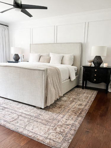 Black and white transitional primary bedroom with picture frame moulding #primarybedroom #transitionalbedroom #blackandwhitebedroom #modernbedroom