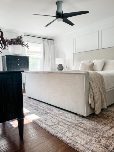 Black and white transitional primary bedroom with picture frame moulding #primarybedroom #transitionalbedroom #blackandwhitebedroom #modernbedroom