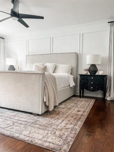 Black and white transitional primary bedroom with picture frame moulding #primarybedroom #transitionalbedroom #blackandwhitebedroom #modernbedroom