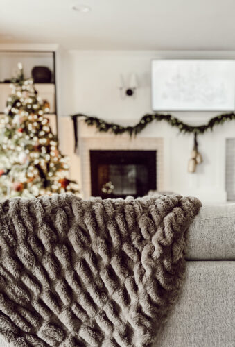 Cozy fireplace mantel decorations that are easy and simple to do! Moody christmas mantel accents, fireplace mantel decorations for the holidays! #christmasmanteldecor #christmasmantle #cozyfireplace