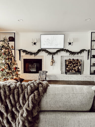 Cozy fireplace mantel decorations that are easy and simple to do! Moody christmas mantel accents, fireplace mantel decorations for the holidays! #christmasmanteldecor #christmasmantle #cozyfireplace